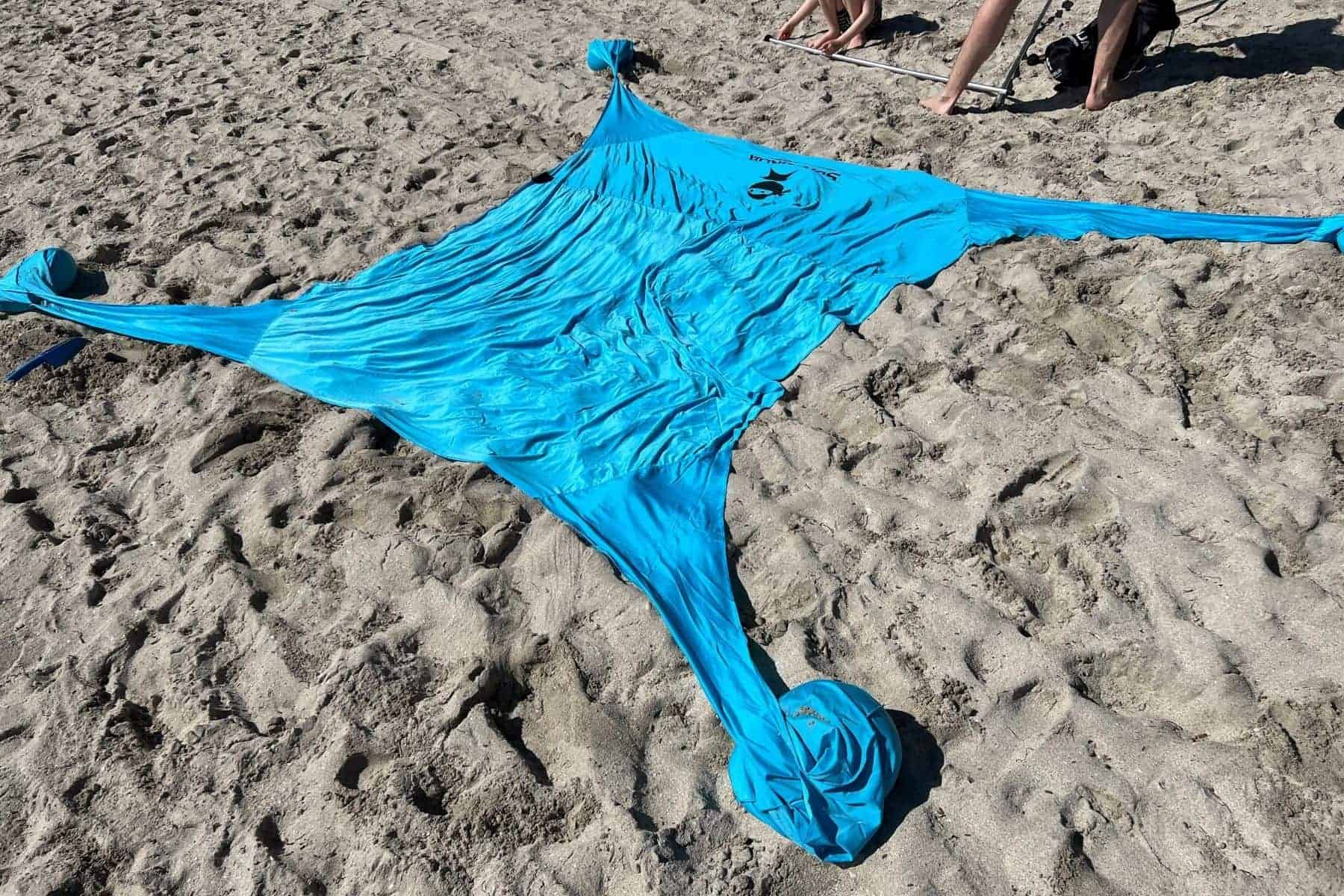 sun-ninja-flat-lay-beach-sand